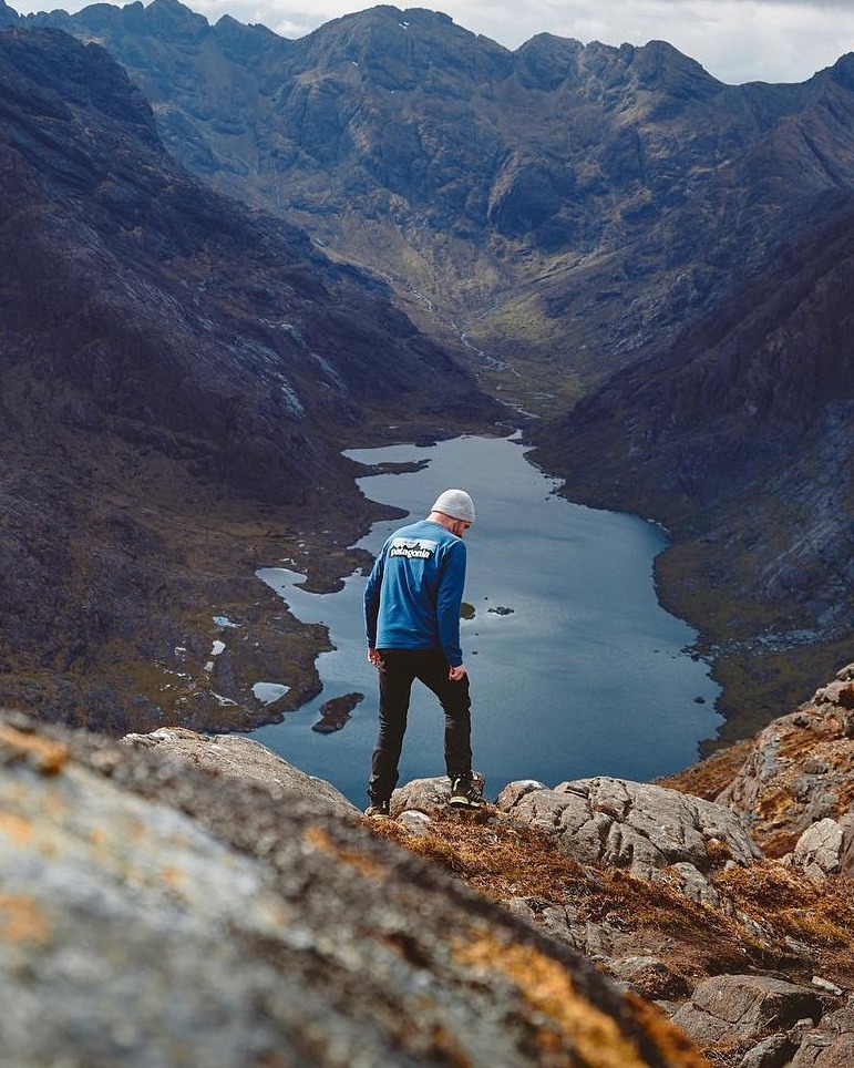 Mat standing on rocks above Loch Coruisk, looking down into the valley